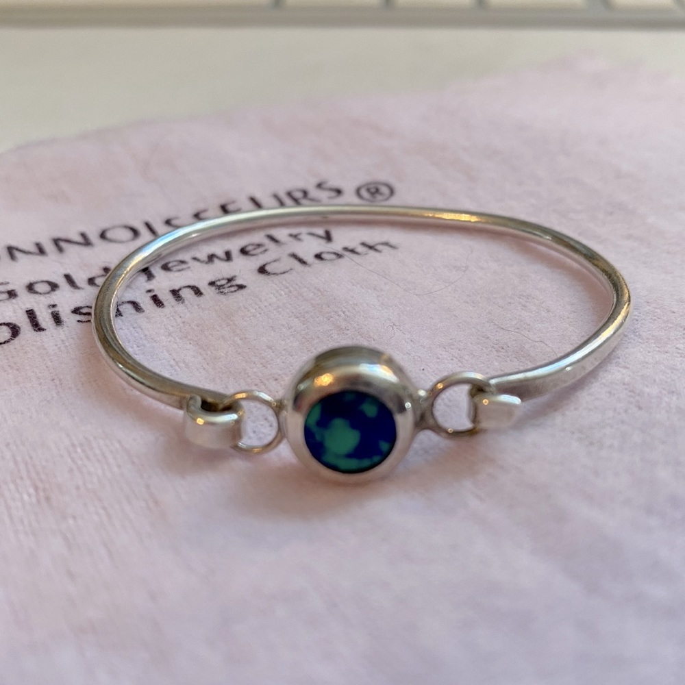 Sterling silver bracelet with blue / teal stone.